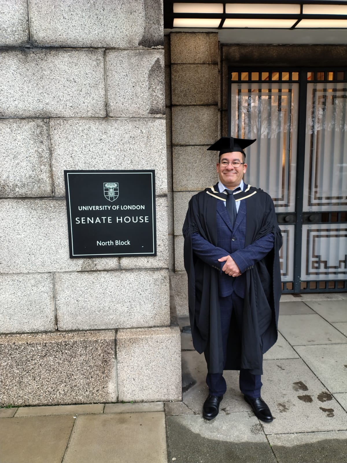 Alvaro De Bartolo in graduation attire outside Senate House, University of London